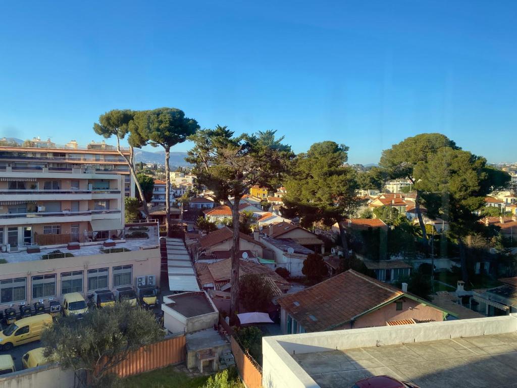 an overhead view of a city with trees and buildings at Coquet logement front de mer in Cagnes-sur-Mer