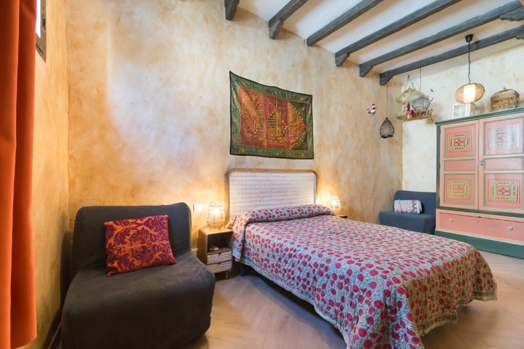 Postel nebo postele na pokoji v ubytování Hostal Artistic B&B