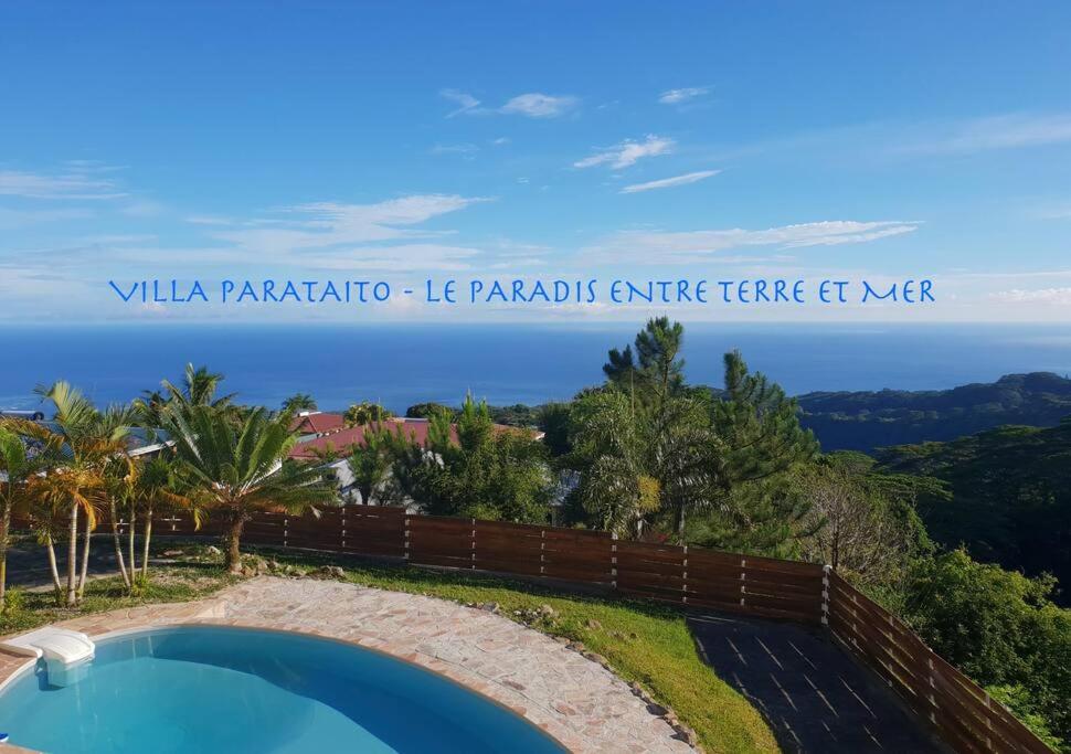 a view of a swimming pool in a villa margarita las papas at Villa Parataito- Le Paradis entre Terre et Mer in Mahina