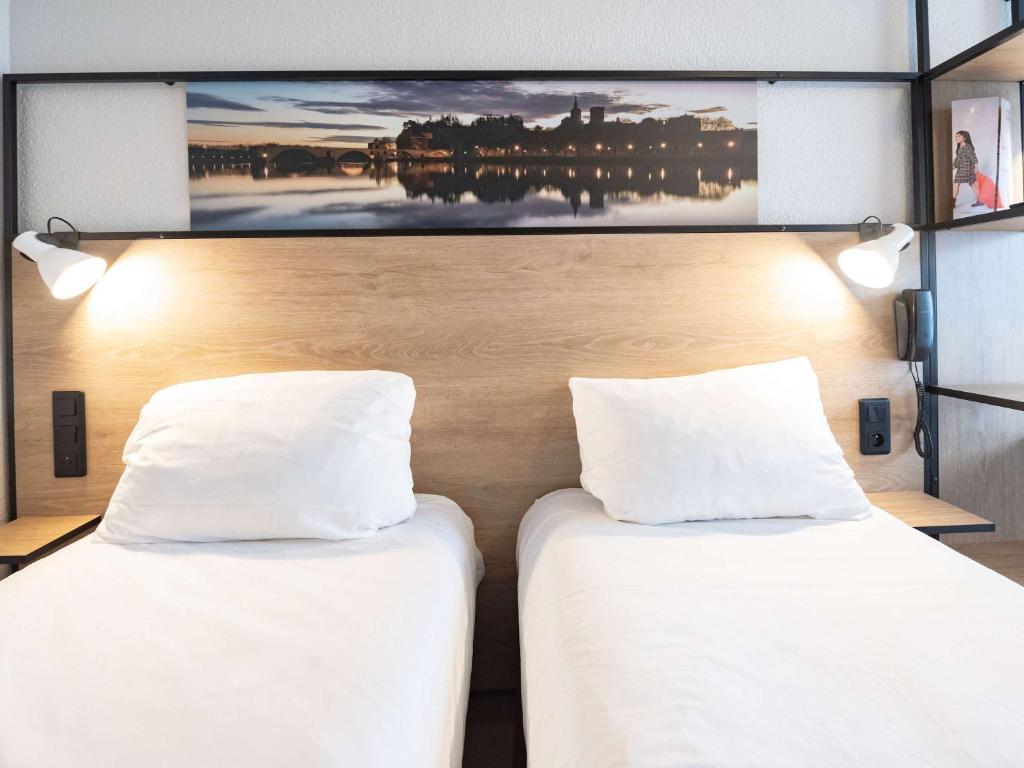 Postel nebo postele na pokoji v ubytování ibis Avignon Centre Pont De L'Europe
