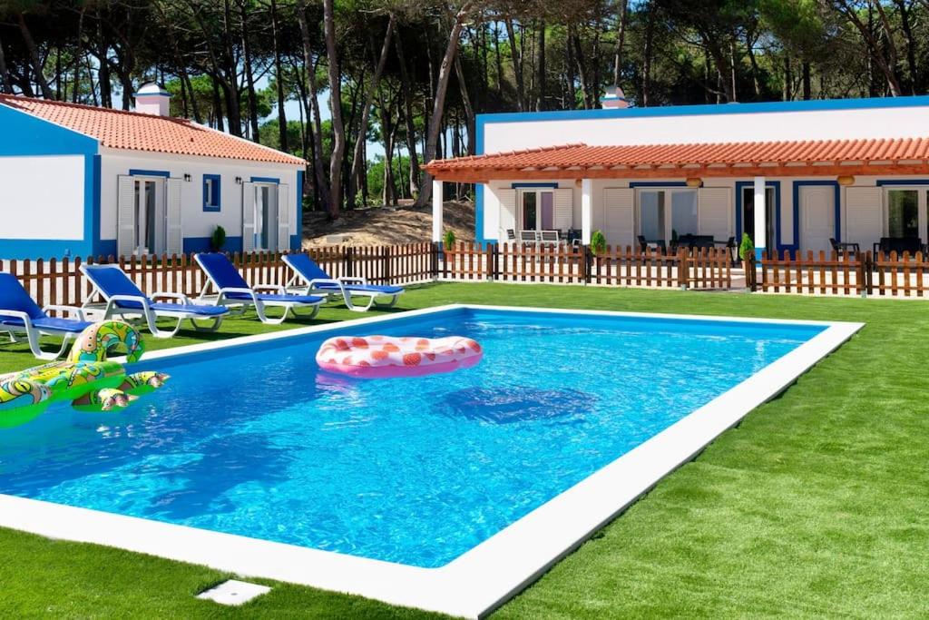 a swimming pool with an inflatable at Casas de Santa Maria in Sintra