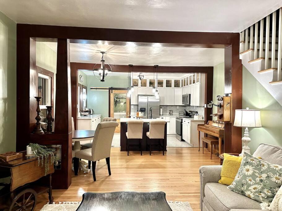 a living room with a kitchen and a dining room at The Vintage Daisy in Pocatello