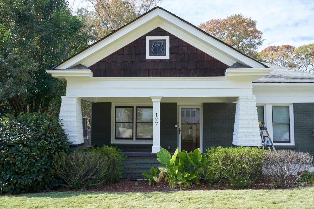 a house with a black and white at Downtown Gem 5 Min To City, Near Marta & Pullman in Atlanta