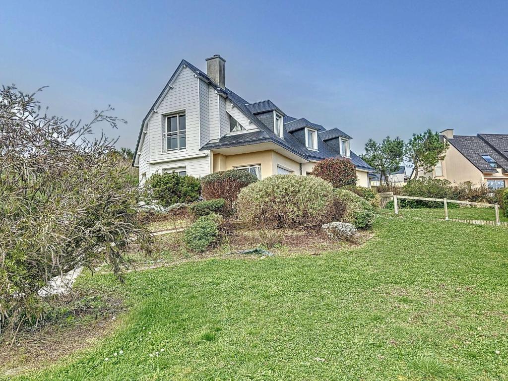 a large house with a yard in front of it at Maison proche plage, 8 pers, 3 ch, jardin, Wi-Fi, clim - FR-1-361-533 in Saint-Pair-sur-Mer