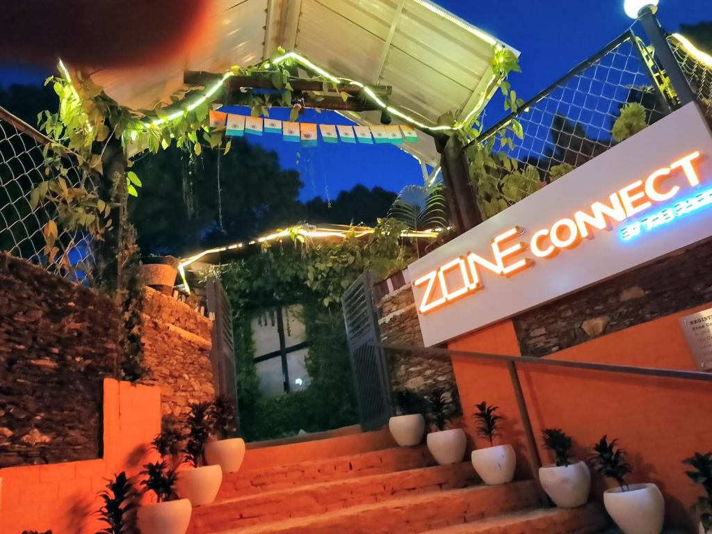 an entrance to a zine connect restaurant at night at Zone Connect by The Park, Lansdowne in Lansdowne