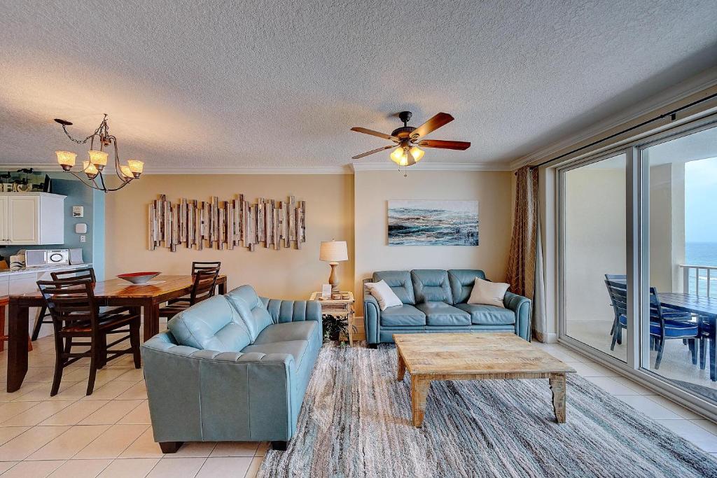 a living room with a couch and a table at Ocean Villa 1104 in Panama City Beach