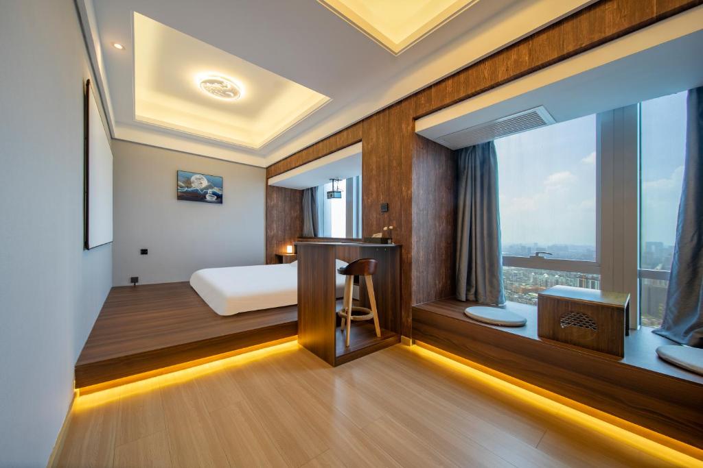 Postel nebo postele na pokoji v ubytování Xingyin Cloudy Hotel Guangzhou Changgang Subway Station - Free Shuttle Bus to Canton Fair Complex During Canton Fair Period