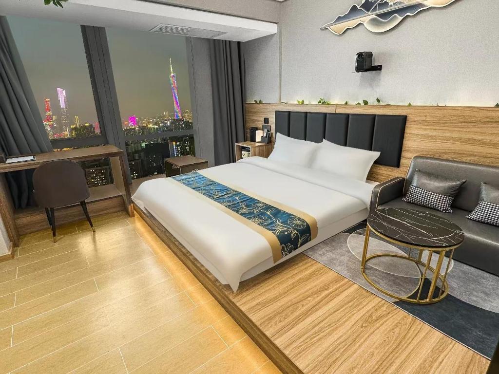 Postel nebo postele na pokoji v ubytování Xingyin Cloudy Hotel Guangzhou Changgang Subway Station - Free Shuttle Bus to Canton Fair Complex During Canton Fair Period