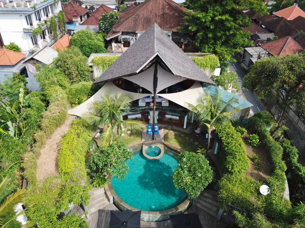 an aerial view of a resort with a swimming pool at Villa Toraja by LifestyleRetreats in Canggu