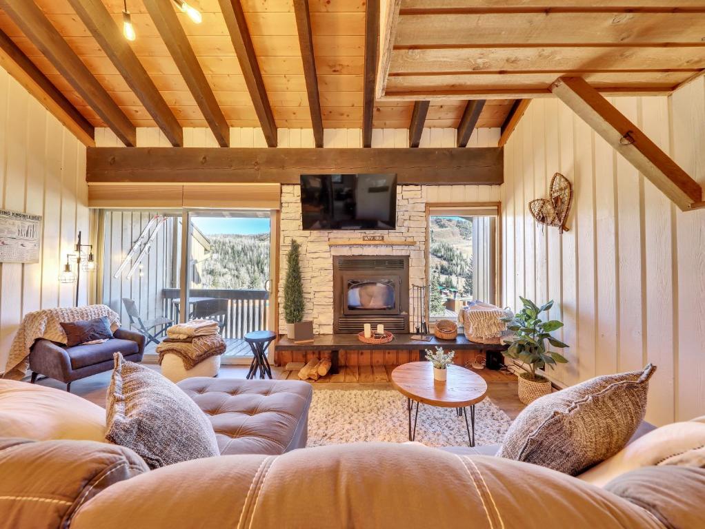 a living room with couches and a fireplace at Bear Paw Run 3-a in Brian Head