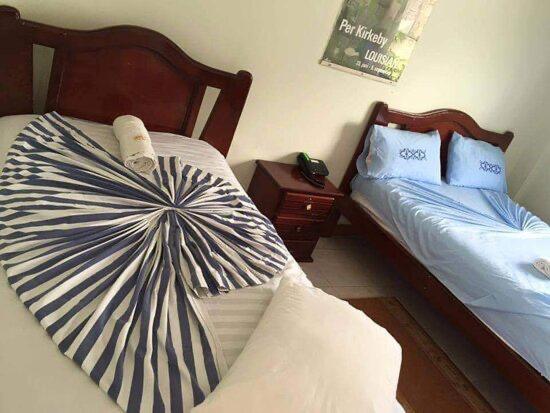 Tempat tidur dalam kamar di Hotel Shekinah Internacional