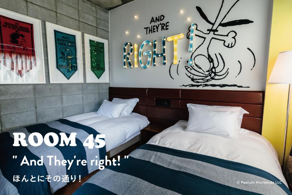 Postel nebo postele na pokoji v ubytování ピーナッツホテル/PEANUTS HOTEL