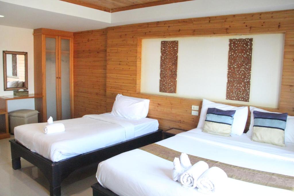 Postel nebo postele na pokoji v ubytování Maekhong Delta Boutique Hotel