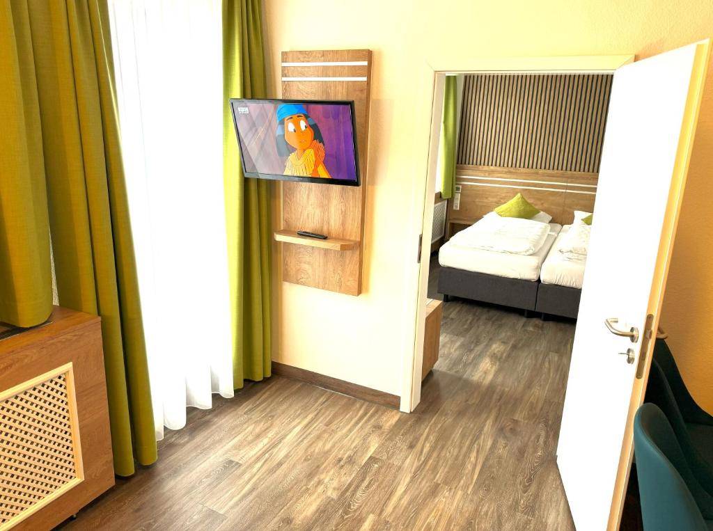 Postel nebo postele na pokoji v ubytování Berghotel Glockenberg