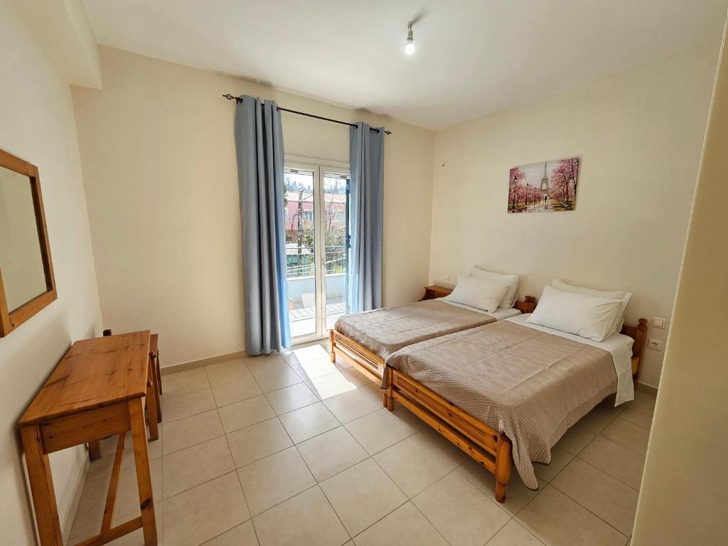 Postel nebo postele na pokoji v ubytování IPSOS SUPERIOR APARTMENTS