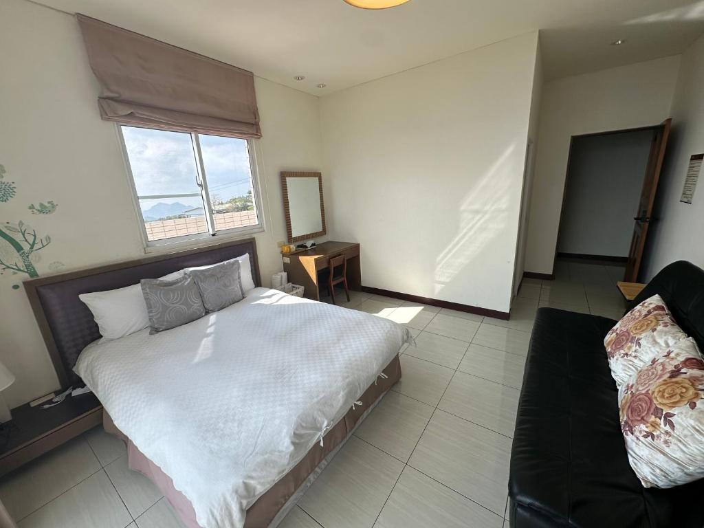 Postel nebo postele na pokoji v ubytování Siangting B&B