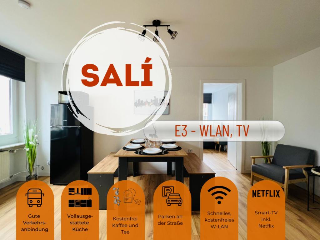een kamer met een verkoopbord en een tafel bij Sali - E3 - WLAN, TV in Essen