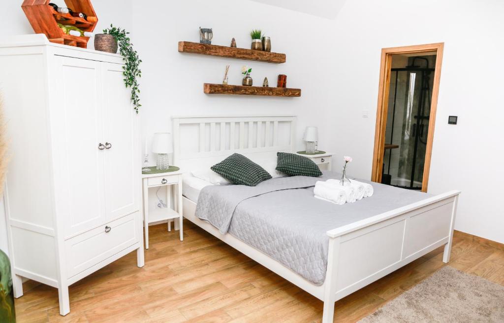 Postel nebo postele na pokoji v ubytování Apartmány Ellie