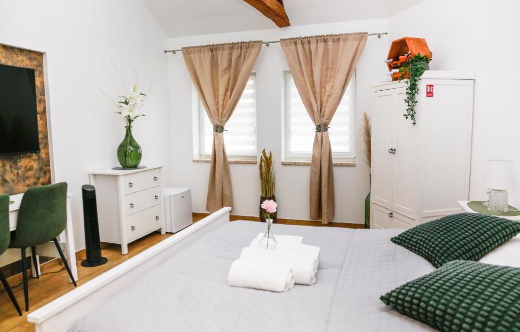 Postel nebo postele na pokoji v ubytování Apartmány Ellie