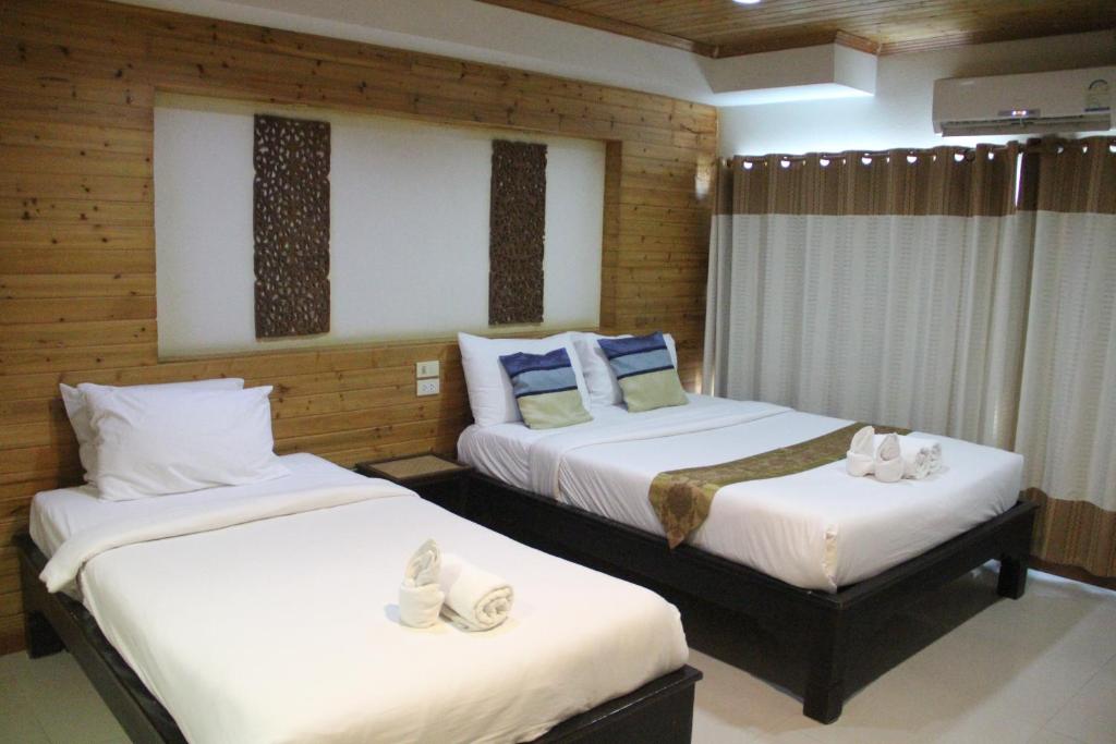 Postel nebo postele na pokoji v ubytování Maekhong Delta Boutique Hotel
