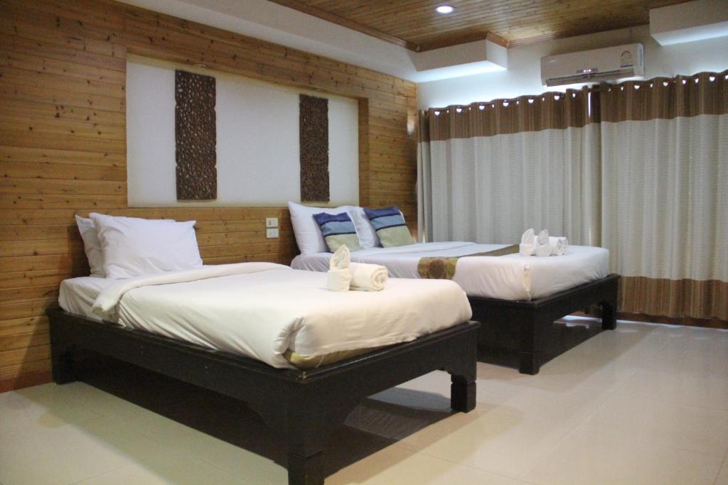 Postel nebo postele na pokoji v ubytování Maekhong Delta Boutique Hotel