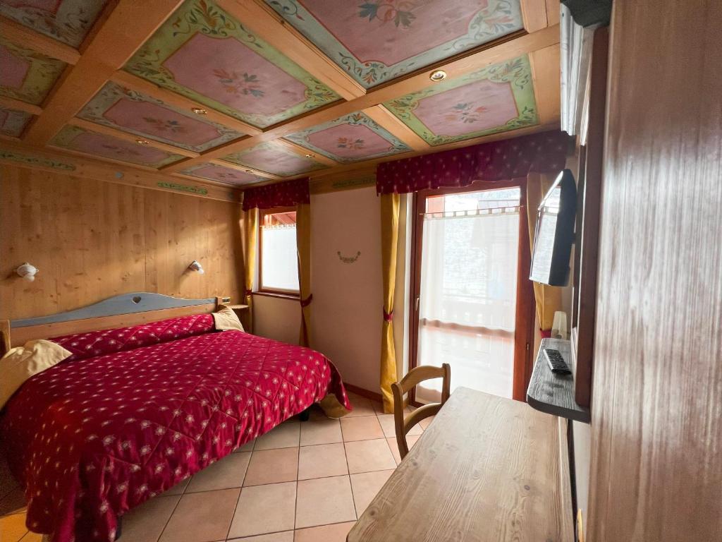 Łóżko lub łóżka w pokoju w obiekcie Hotel Residence Dahu