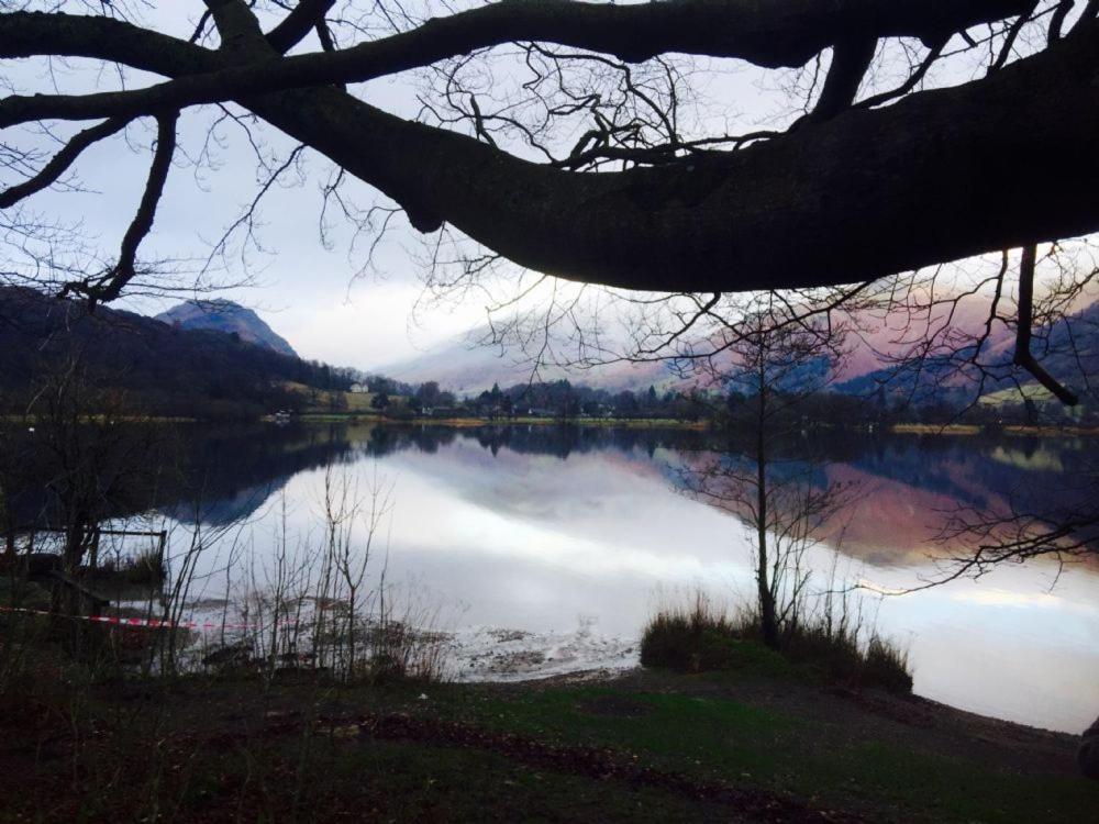 a view of a lake with mountains in the background at Tarn Hut in Rydal