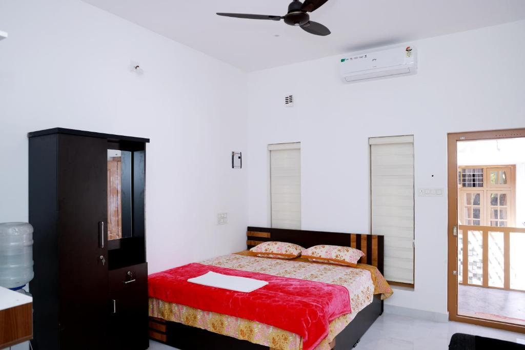 Postel nebo postele na pokoji v ubytování Oxygen Home Stay