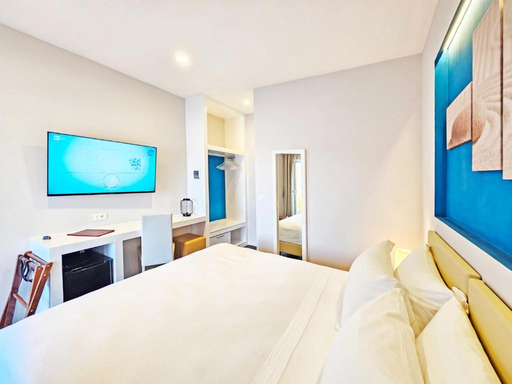 Łóżko lub łóżka w pokoju w obiekcie Hotel l'Approdo
