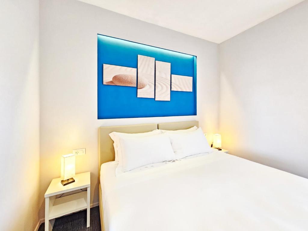 Łóżko lub łóżka w pokoju w obiekcie Hotel l'Approdo