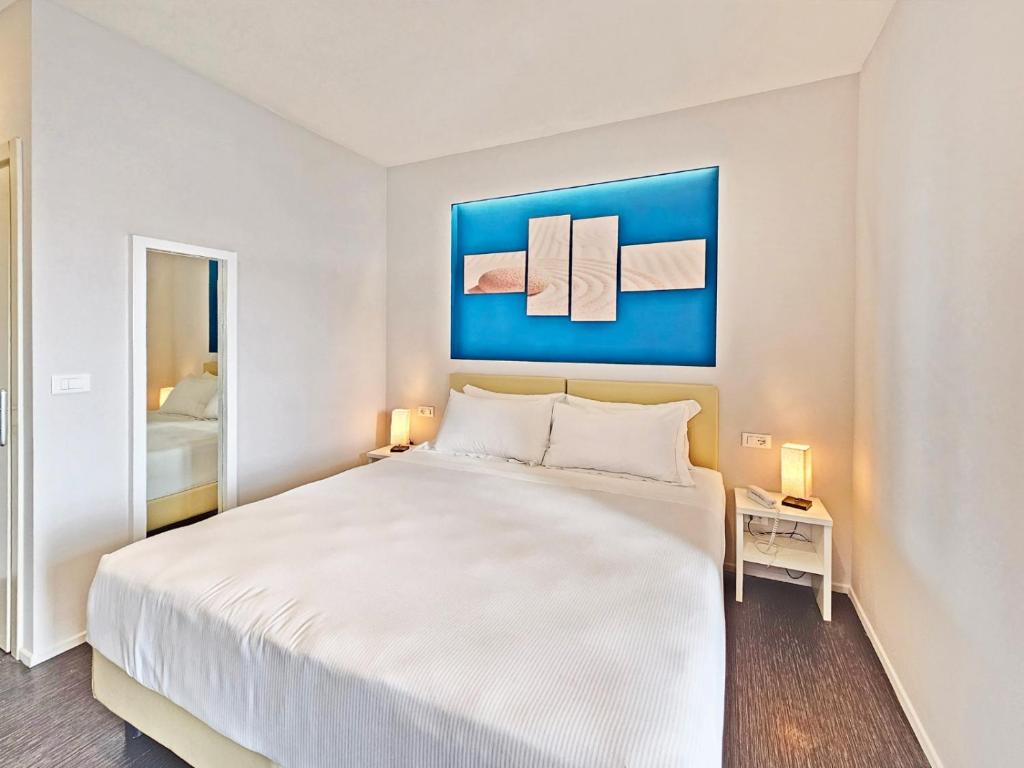 Łóżko lub łóżka w pokoju w obiekcie Hotel l'Approdo