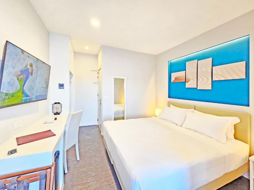 Łóżko lub łóżka w pokoju w obiekcie Hotel l'Approdo