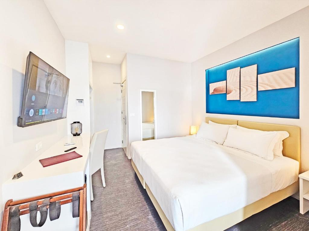 Łóżko lub łóżka w pokoju w obiekcie Hotel l'Approdo