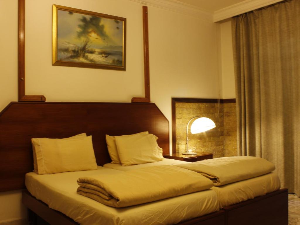 Postel nebo postele na pokoji v ubytování Viccini Suites