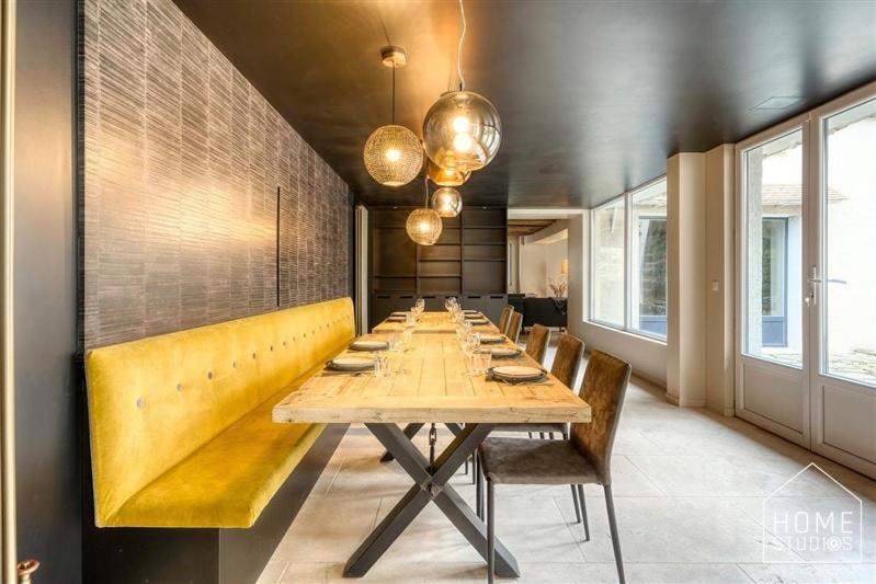 a long dining room with a long table and chairs at La demeure des Saga - Luxe et foret in Arbonne-la-Foret