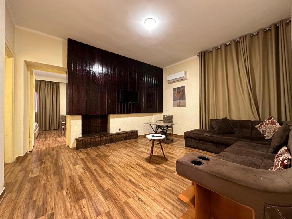 a living room with a couch and a fireplace at egy days apartment in Cairo