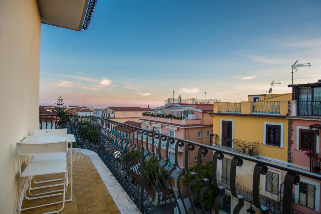 a balcony with a view of a city at Hotel Bolivar in Marina di Camerota