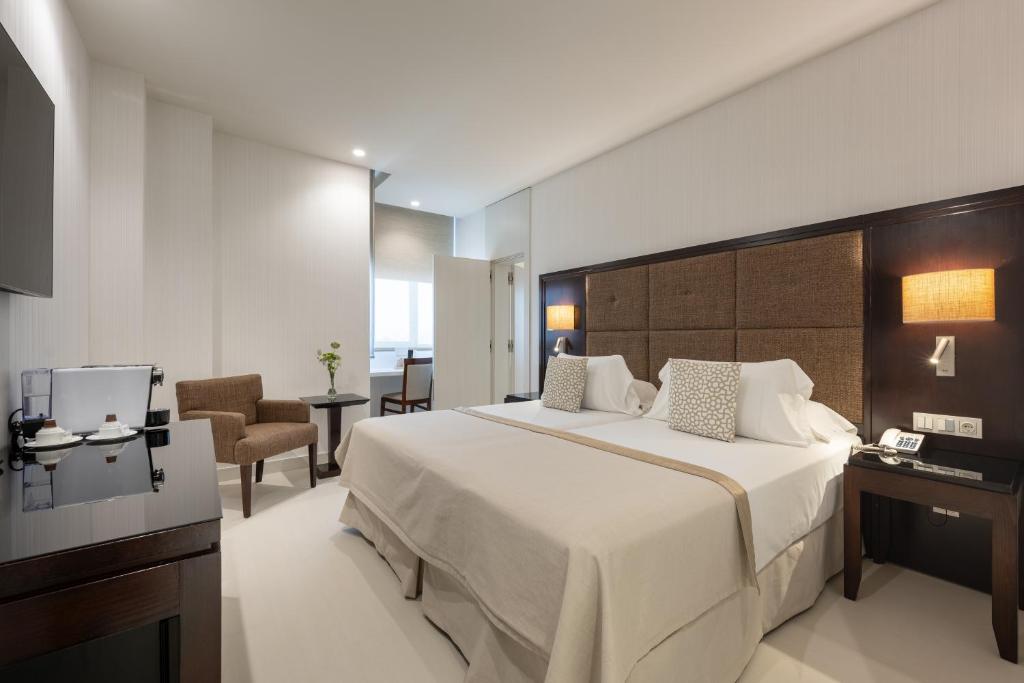 Postel nebo postele na pokoji v ubytování Hotel Saray