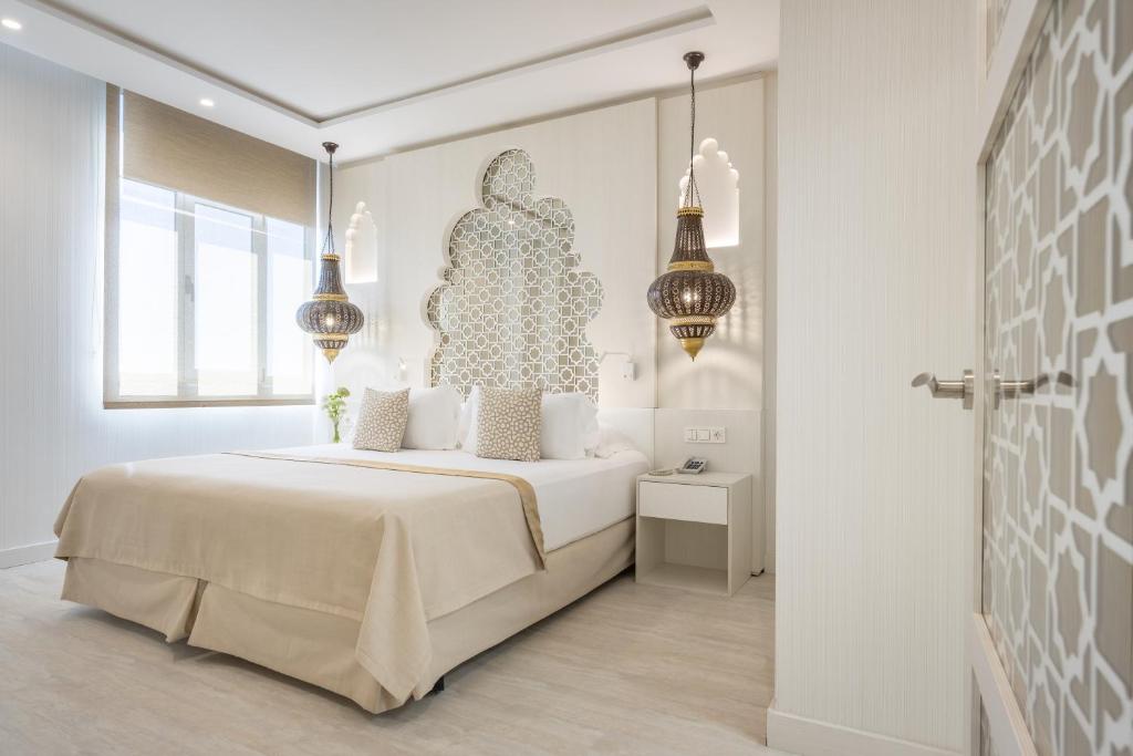 Postel nebo postele na pokoji v ubytování Hotel Saray
