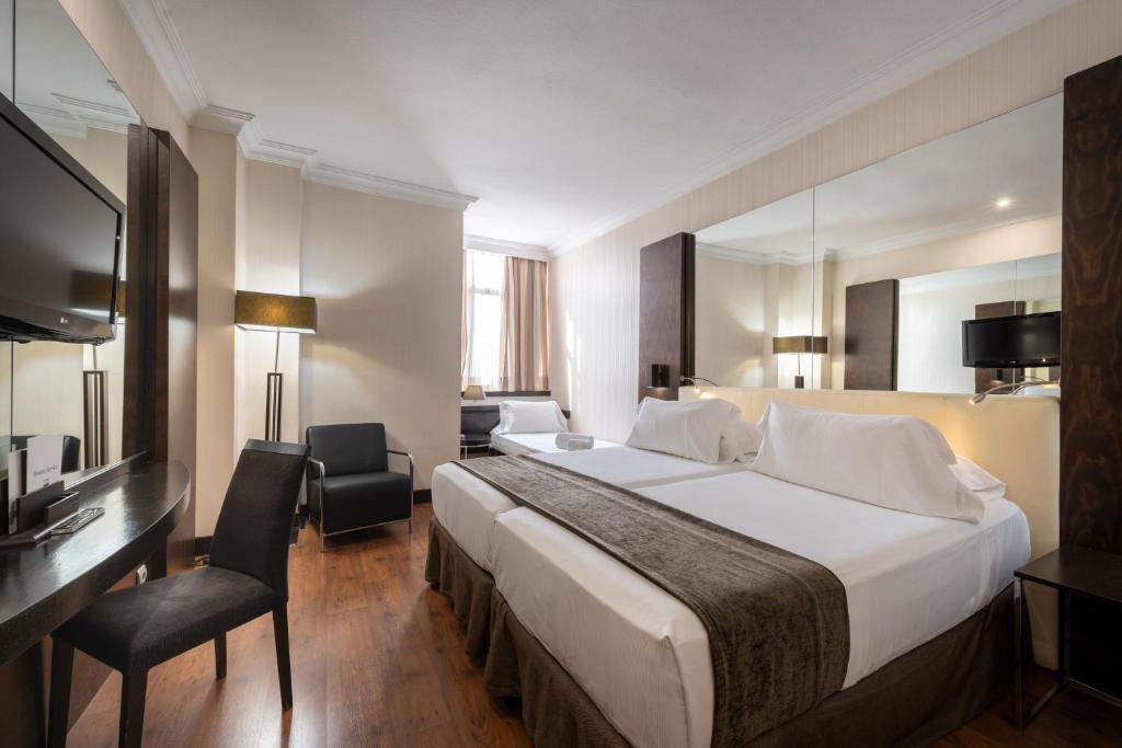 Postel nebo postele na pokoji v ubytování Hotel Saray