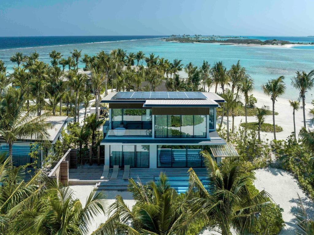 an aerial view of a house on the beach at SO/ Maldives in South Male Atoll