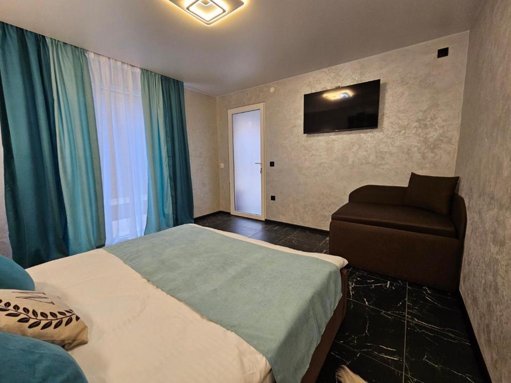 Postel nebo postele na pokoji v ubytování Villa Magnat