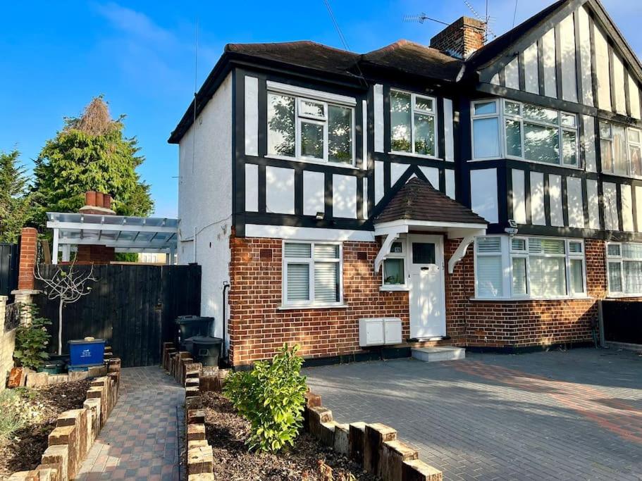 a brick house with a lot of windows at One of a kind 3-bed maisonette with BBQ & sauna in Woodford