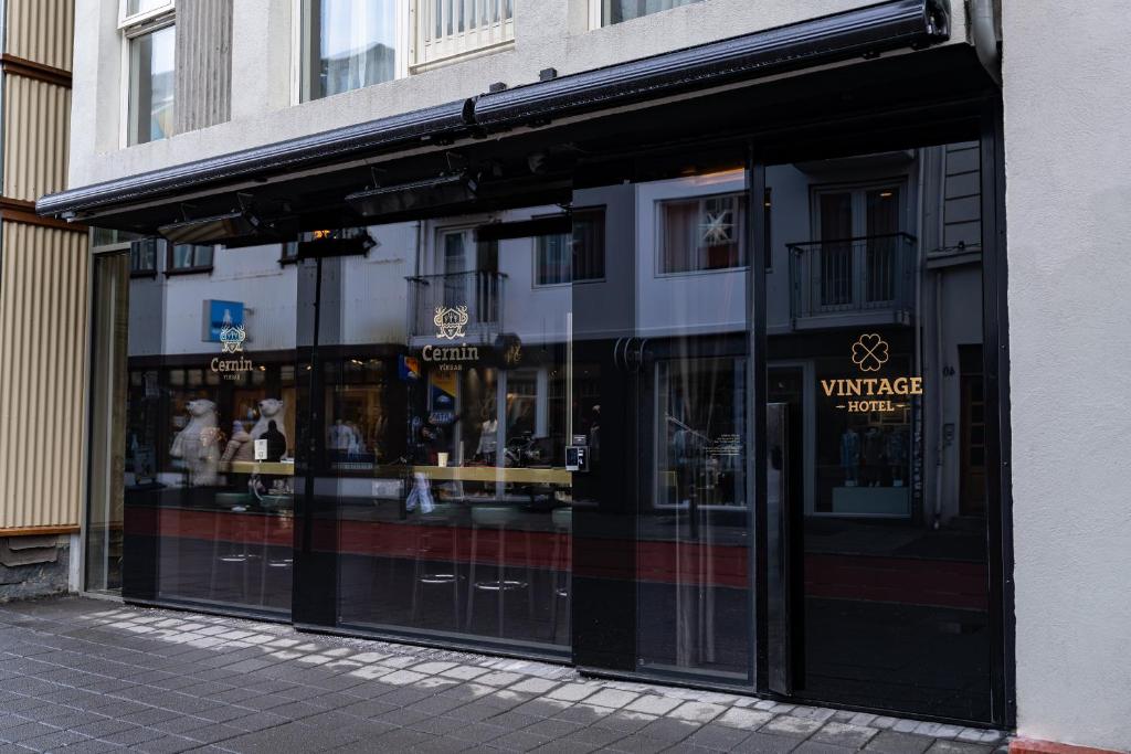 a store front with glass doors on a street at Vintage Hotel in Reykjavík