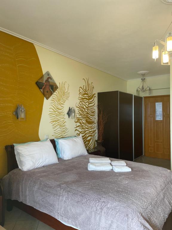 Postel nebo postele na pokoji v ubytování Vythos Rooms