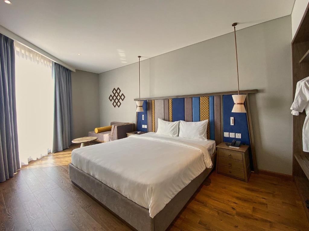 Postel nebo postele na pokoji v ubytování APEC MANDALA CDT - Resort