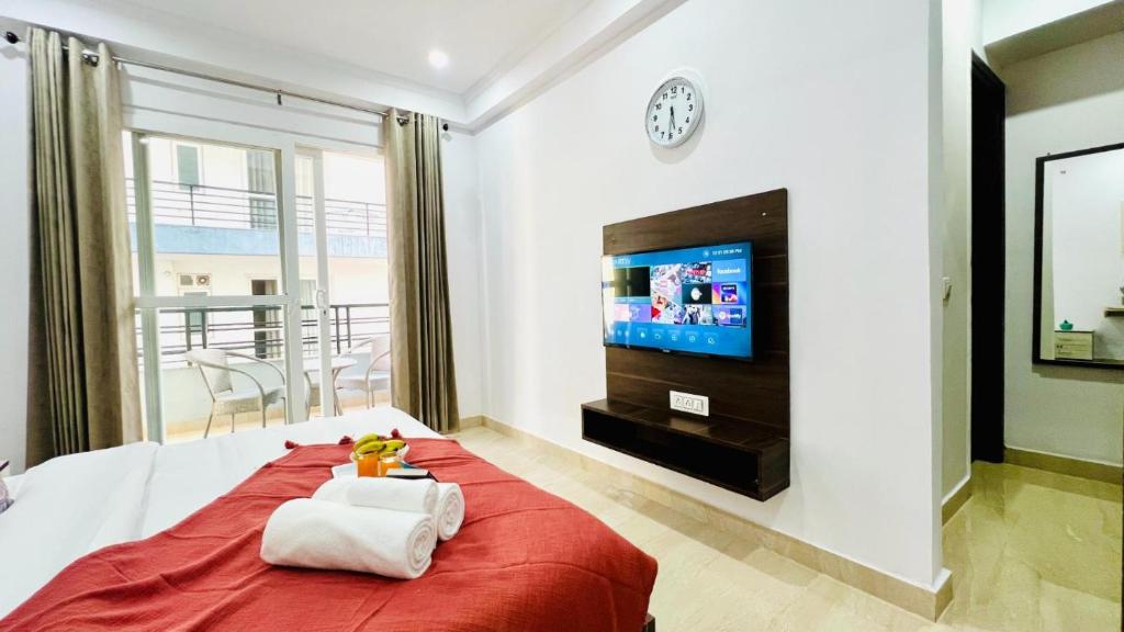 Postel nebo postele na pokoji v ubytování ZEN Suites - Golf Course Road Gurgaon