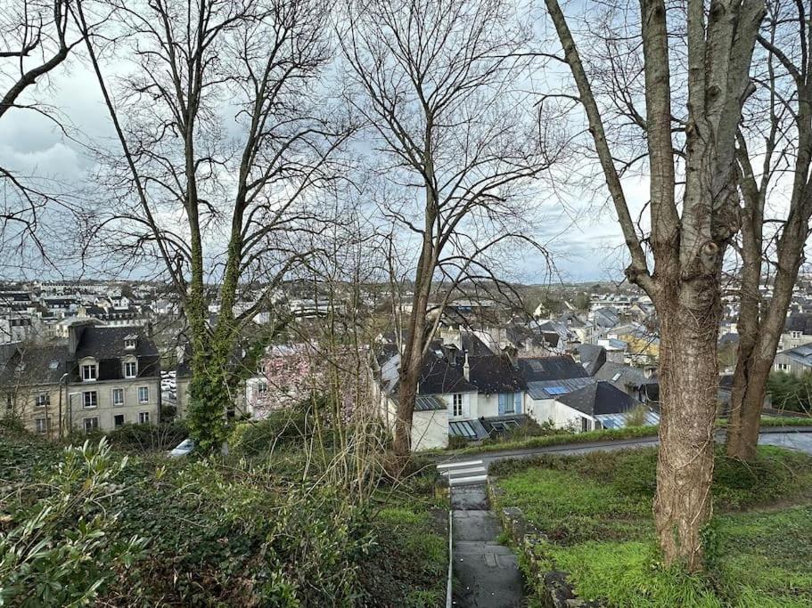 a view of a city with houses and trees at Studio La Petite Montagne in Quimper