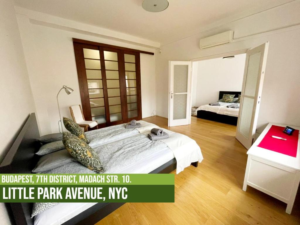 A bed or beds in a room at Little Americas Metropolitan Apartments