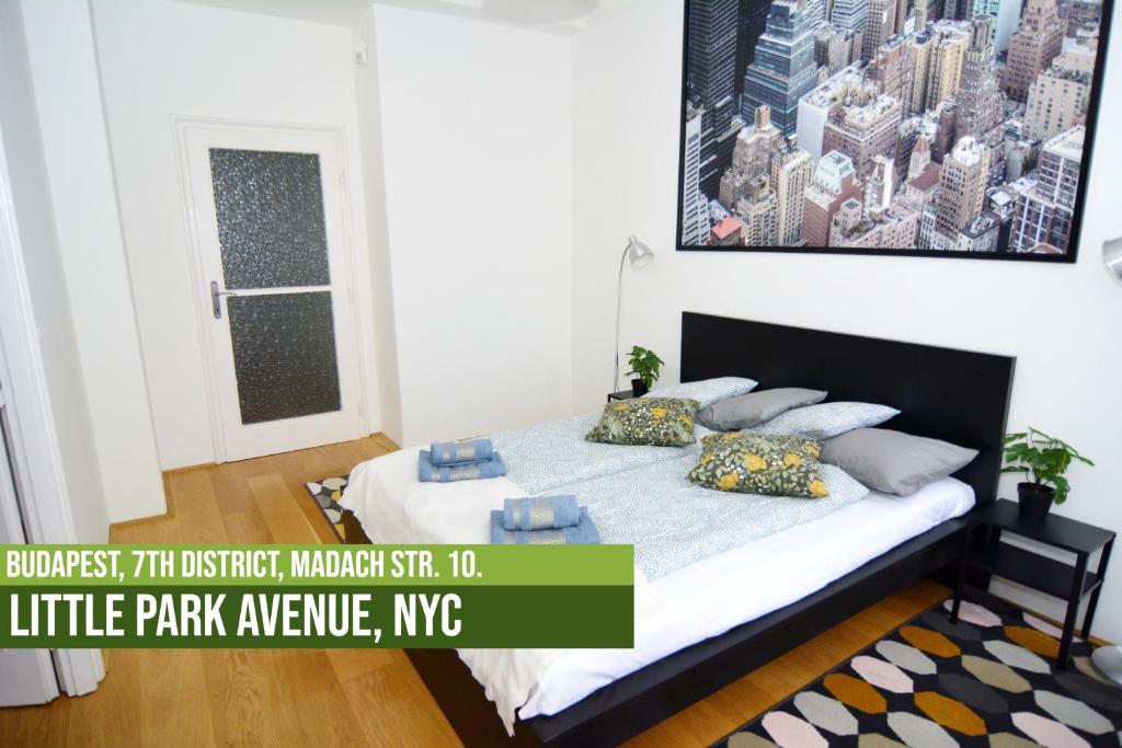 A bed or beds in a room at Little Americas Metropolitan Apartments